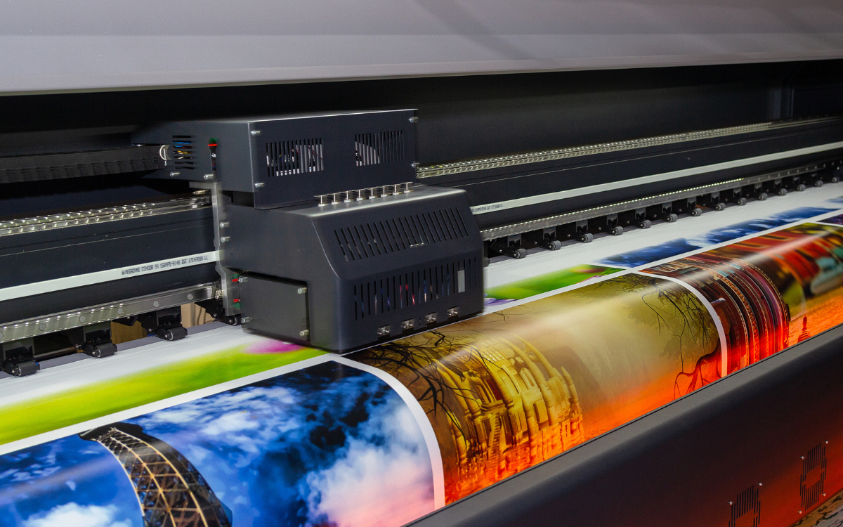 Large-format printer producing vibrant, high-resolution images on a roll of paper.