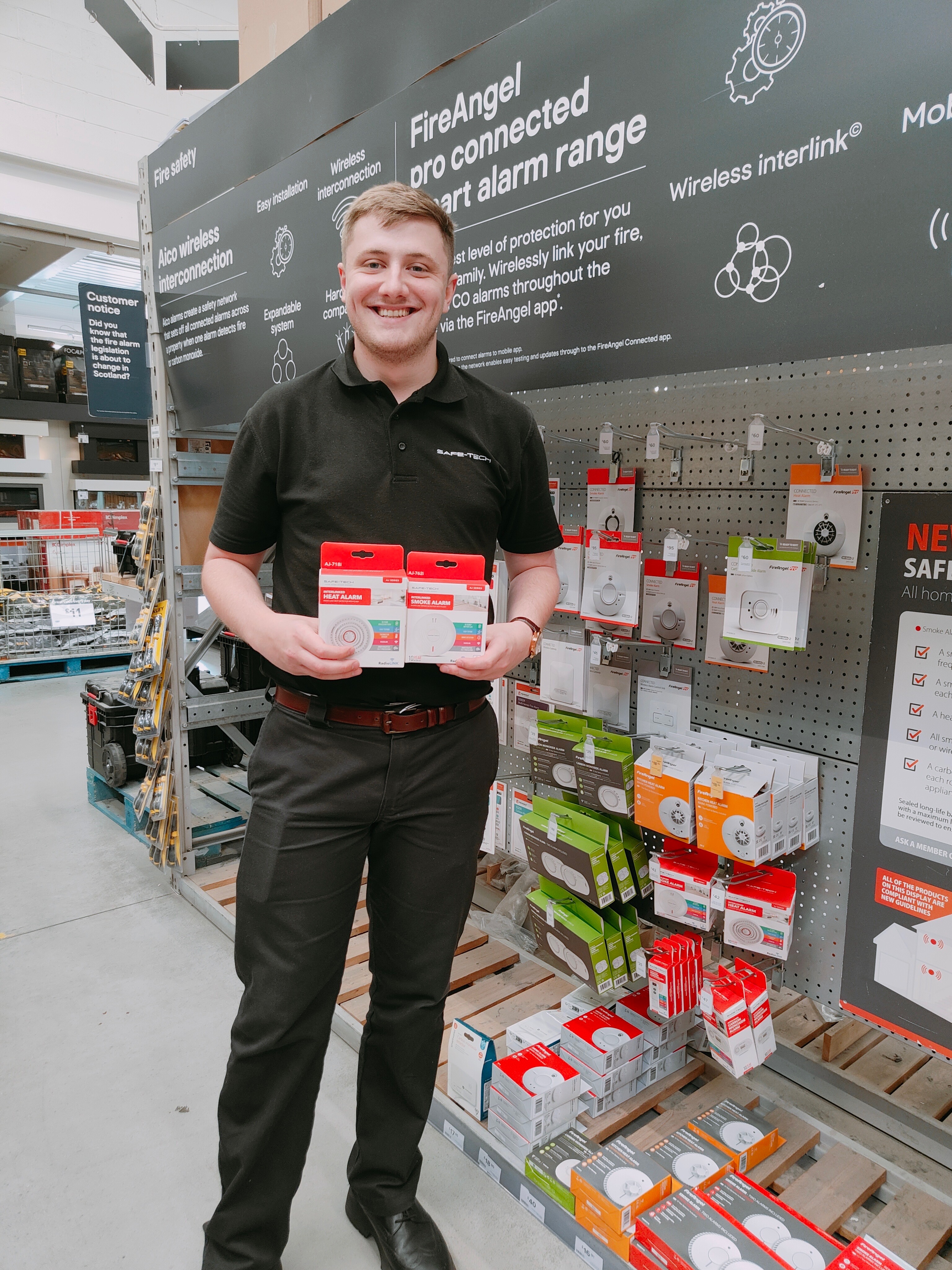 A Safe Tech Employee Displaying Products at B&Q Edinburgh