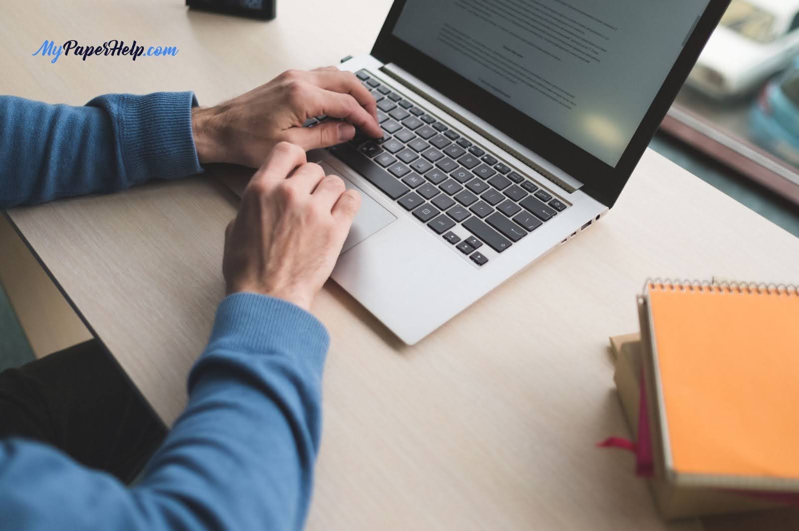 Person typing on laptop