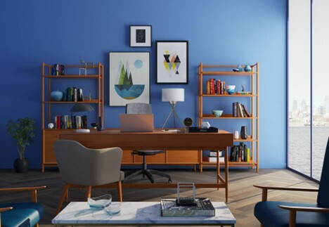 A stylish home office with bright blue walls, wood shelving, and a desk facing a large window with a city view.