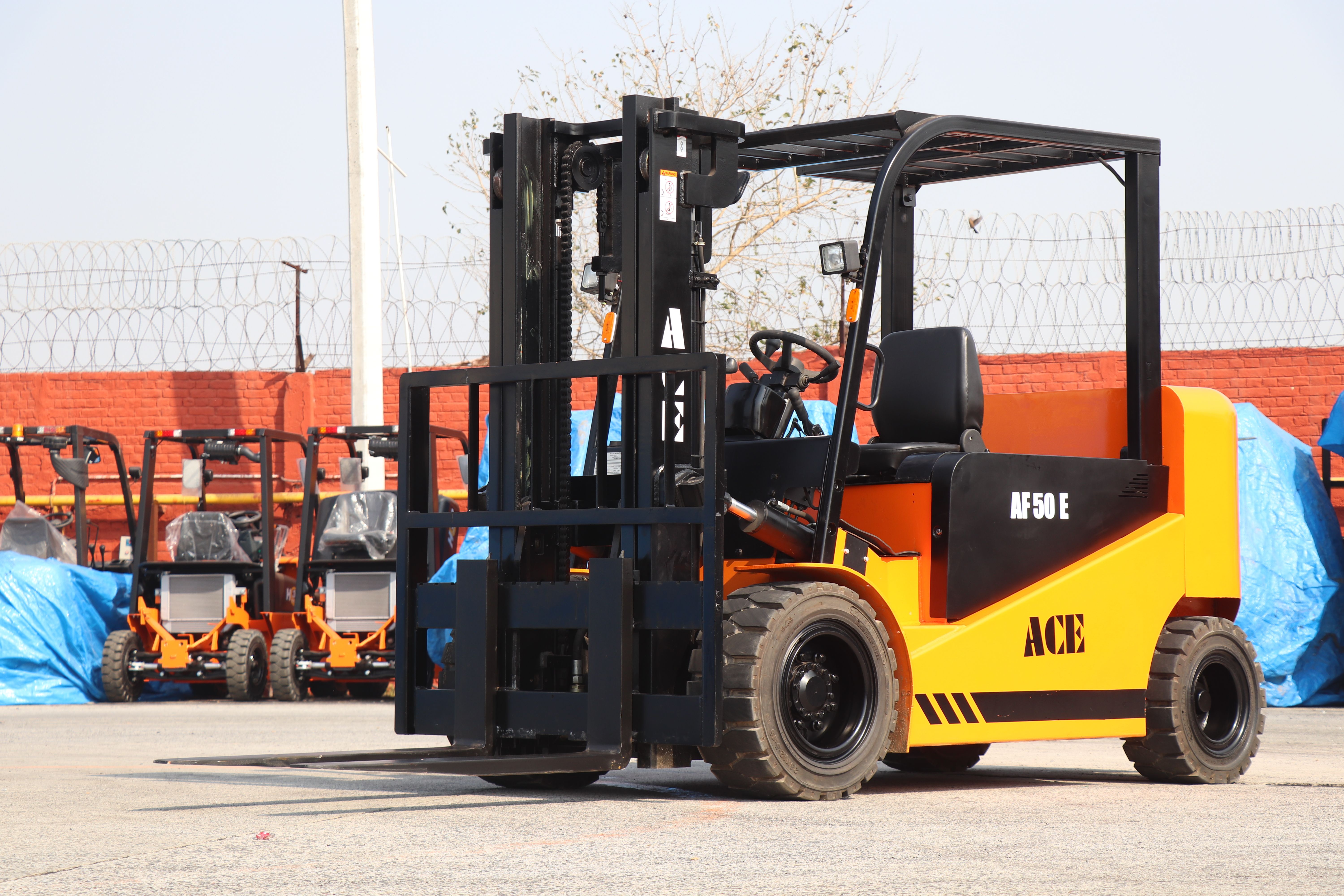 ACE AF50E electric forklift parked in a sunny warehouse area.