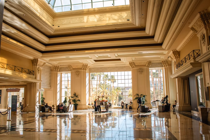 An elegant, well-lit lobby with tall pillars