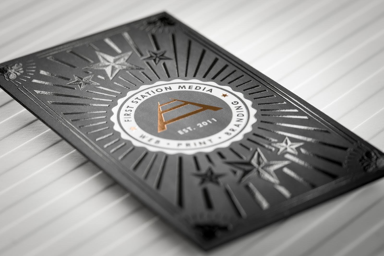 Black business card with 'FIRST STATION MEDIA' logo.
