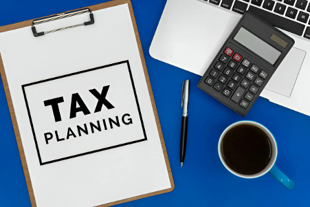 Tax Planning printed on sheet on clipboard
