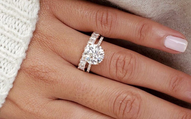 Close up woman hand wearing lab grown diamond ring