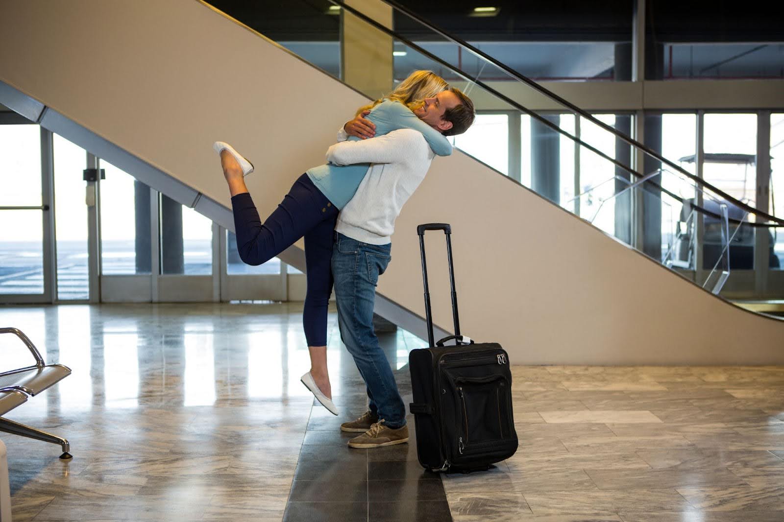 Couple hugging in the airport