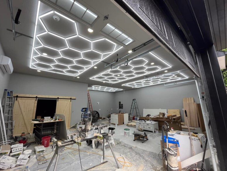 Transform Your Space with Modern Design. A hexagon light in a room that's under construction.