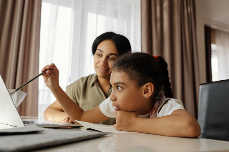 Mother and Child working on homeschooling in 2025