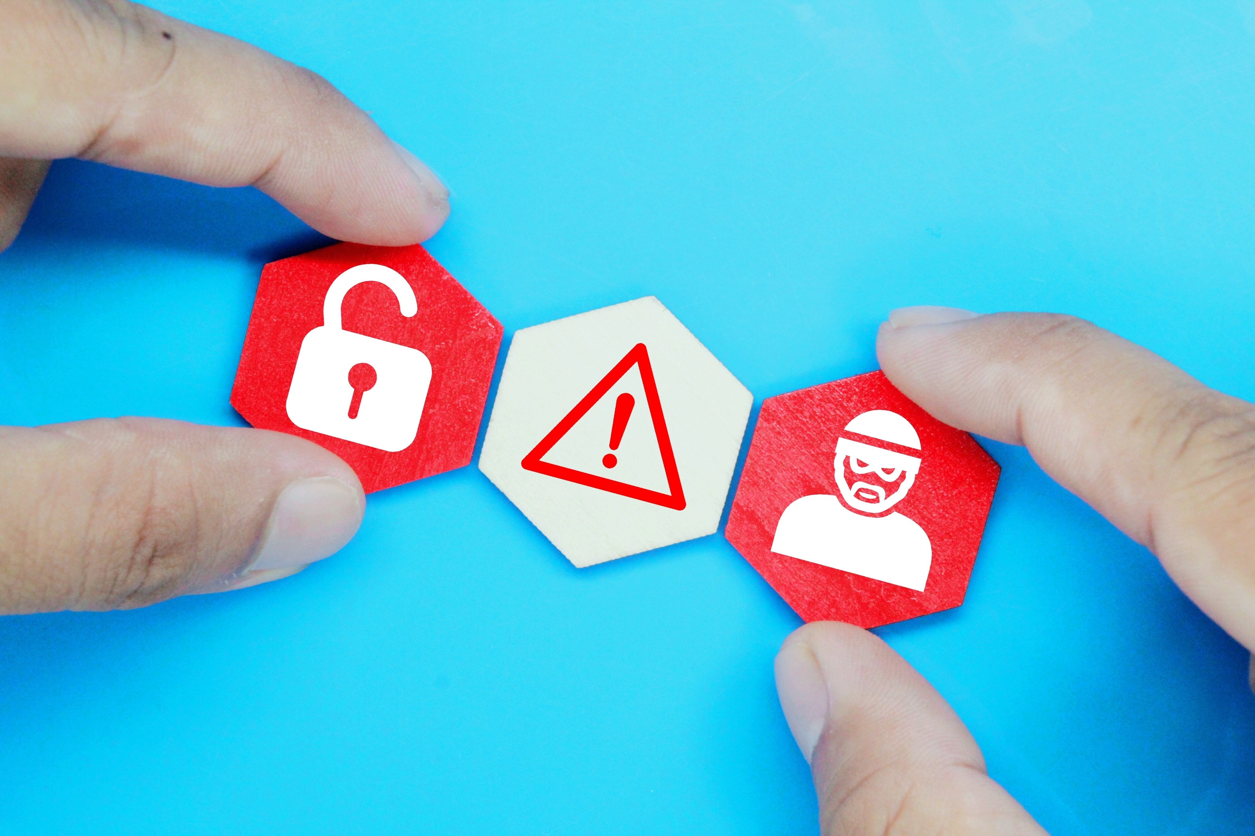 The image shows a representation of spam protection, with a hexagon containing cyber robber icons. 