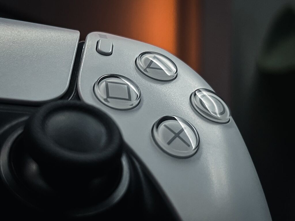 Close up photo of game controller as concept image for How to Use FC Coins to Build Unique Squads and Tactical Strategies