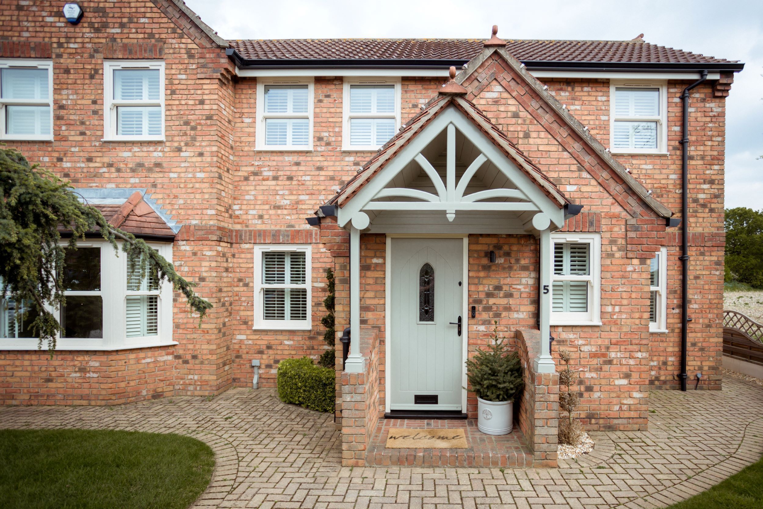 Modern Home Featuring Traditional-Style Sash Windows