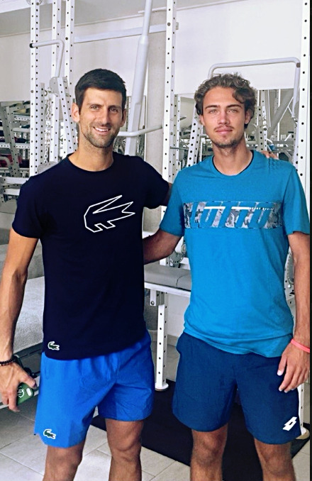 Novak Djokovic (left) and Savriyan Danilov (right) during training