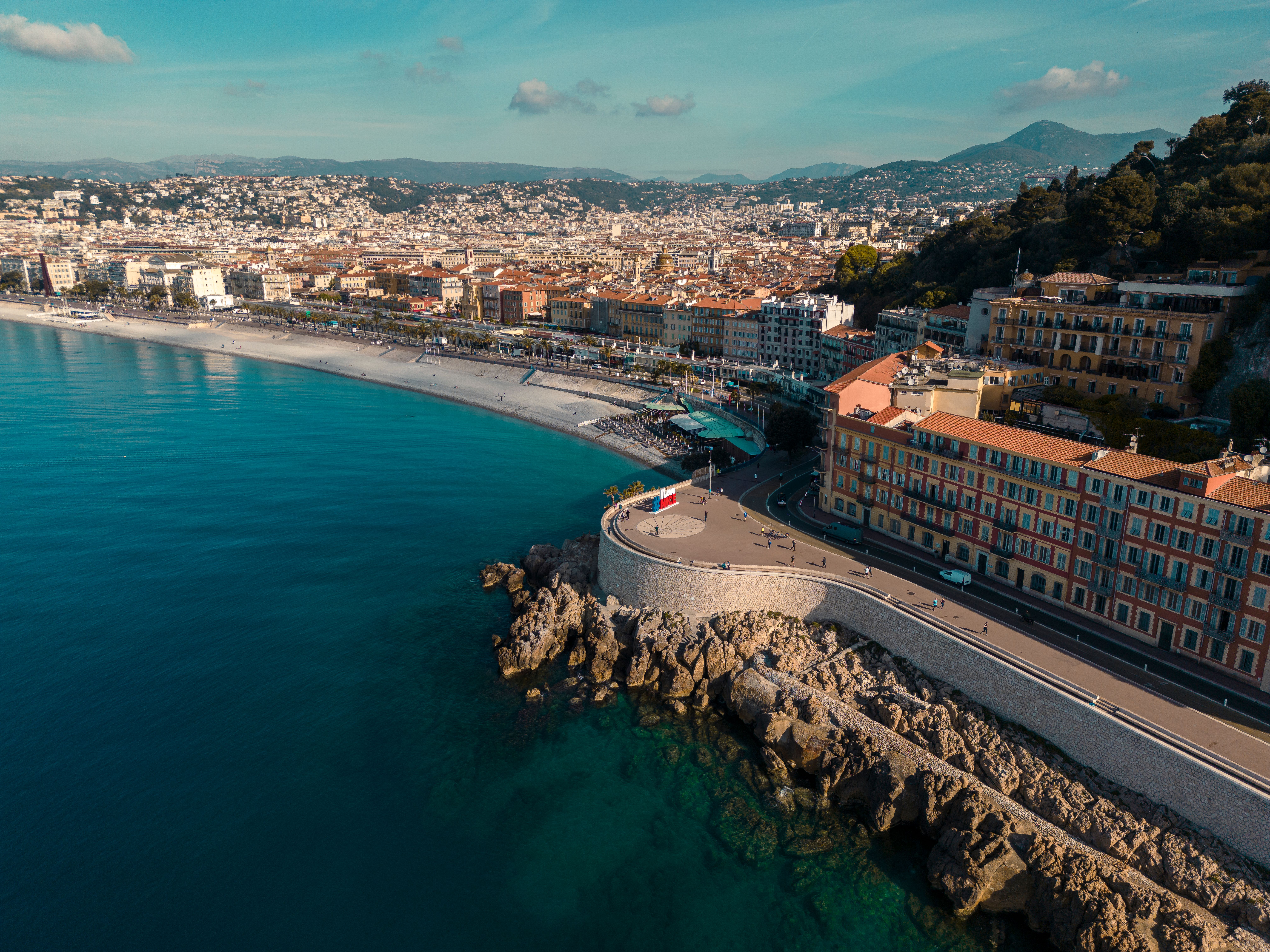 Stunning aerial view of Nice's coastal cityscape along the Mediterranean Sea.