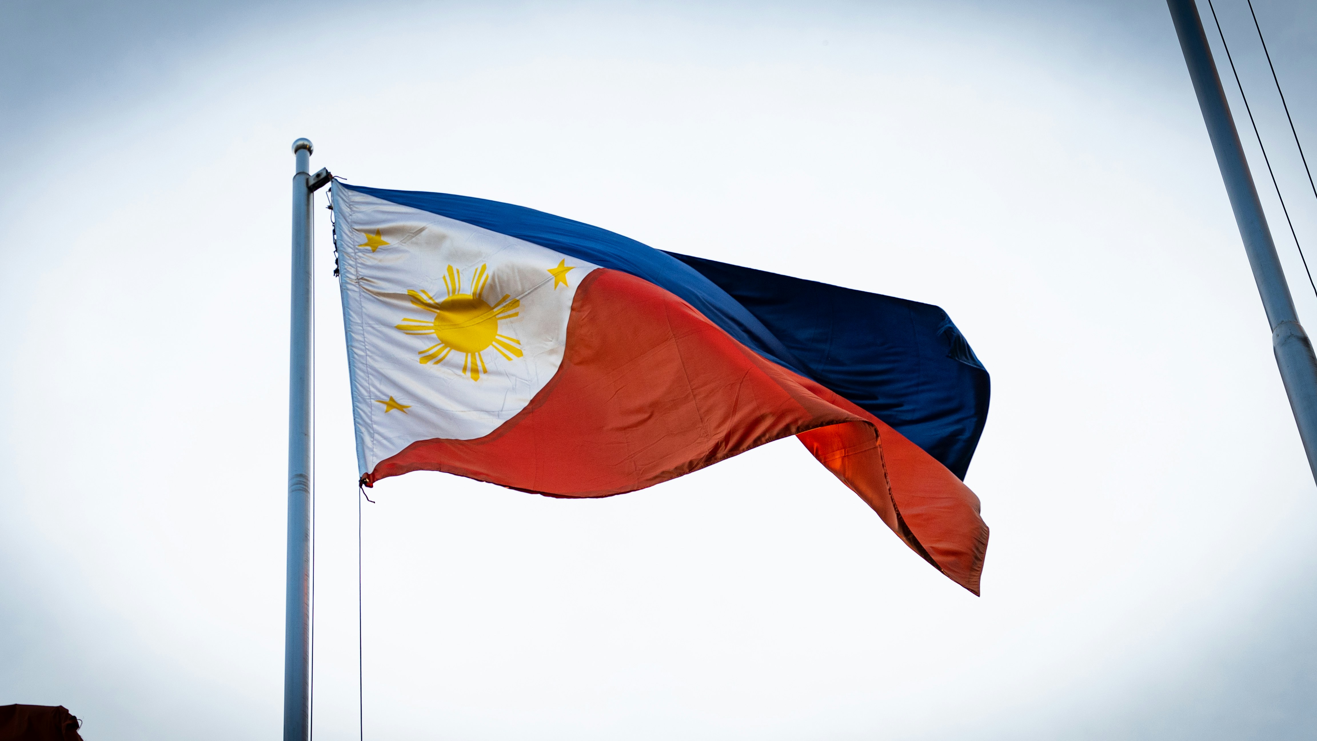 The Philippines Flag Waving on a Pole 