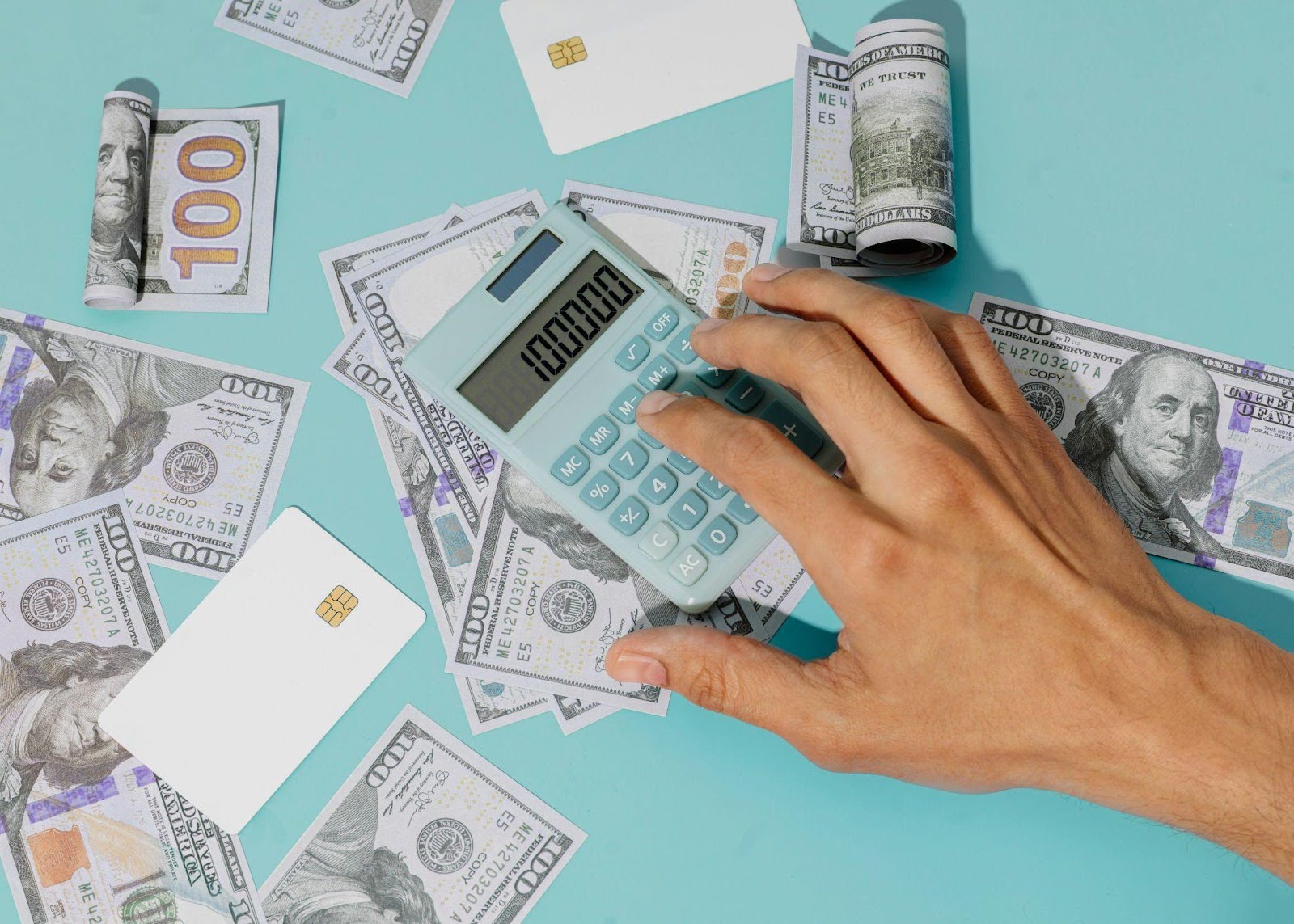 a close up hand holding a calculator