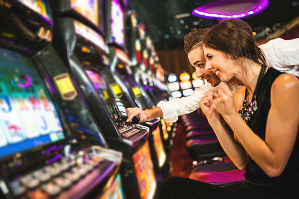 a couple playing slots machine