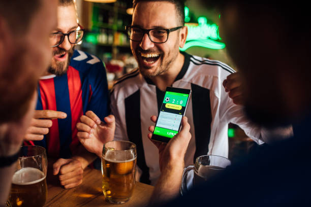 a group of man smiling about football bet app