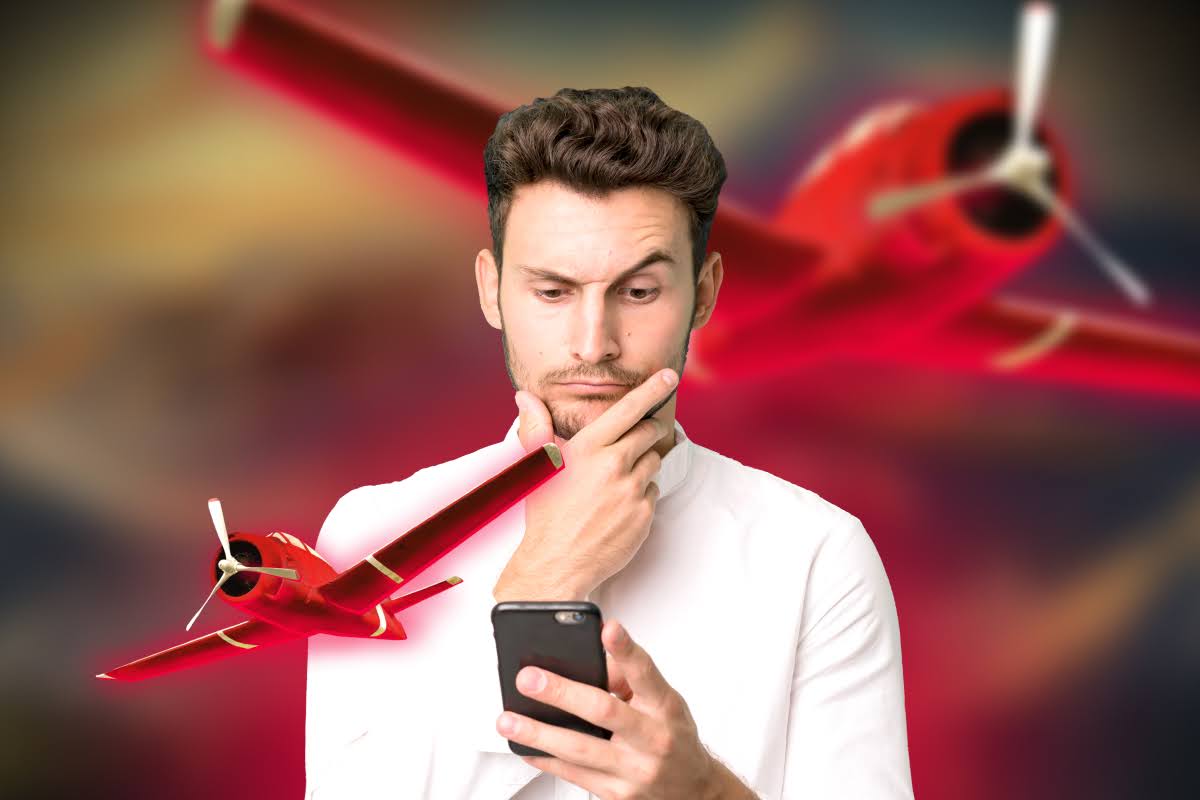 a man thinking while looking at his phone