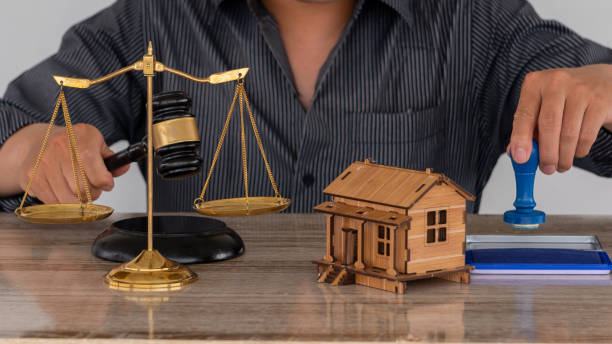 a picture of scale, mini house and stamp