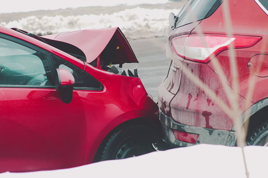 a red car parked next to another red car