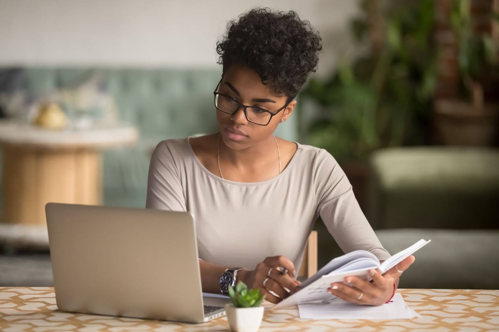 a woman working using a laptop