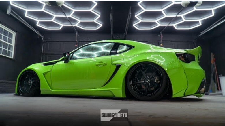Best Lighting Recommendations for Your Garage car in a garage with hexagon lights in the ceiling