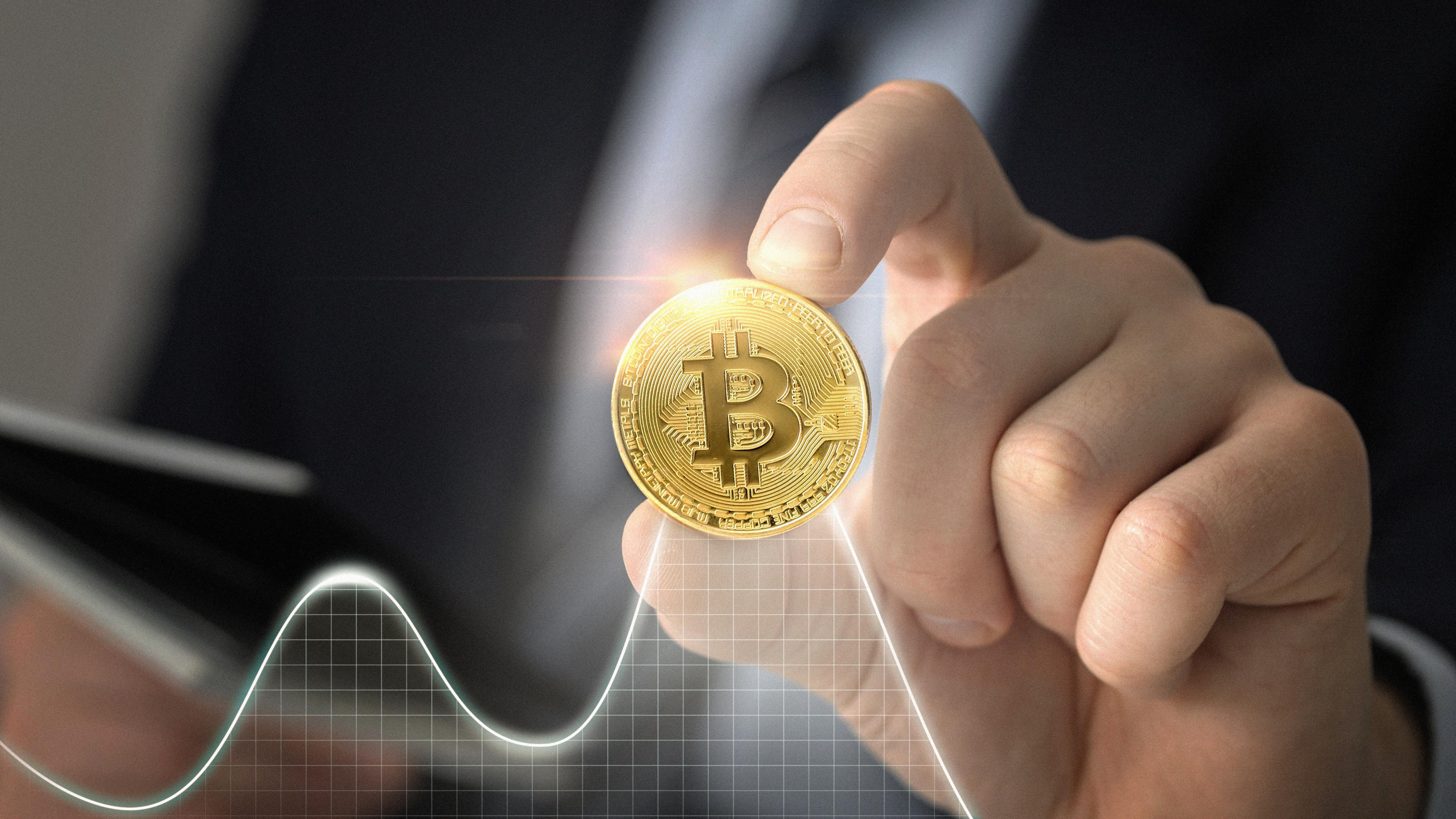 close-up-hand-holding-coin