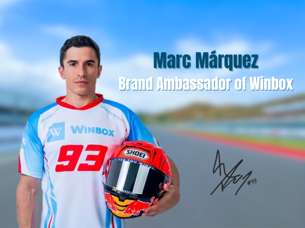 Marc Márquez poses in a white and blue shirt with a Winbox logo, holding a racing helmet, with his signature overlaid on a track background.