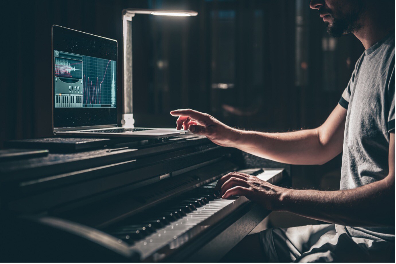 Photo of man playing digital piano