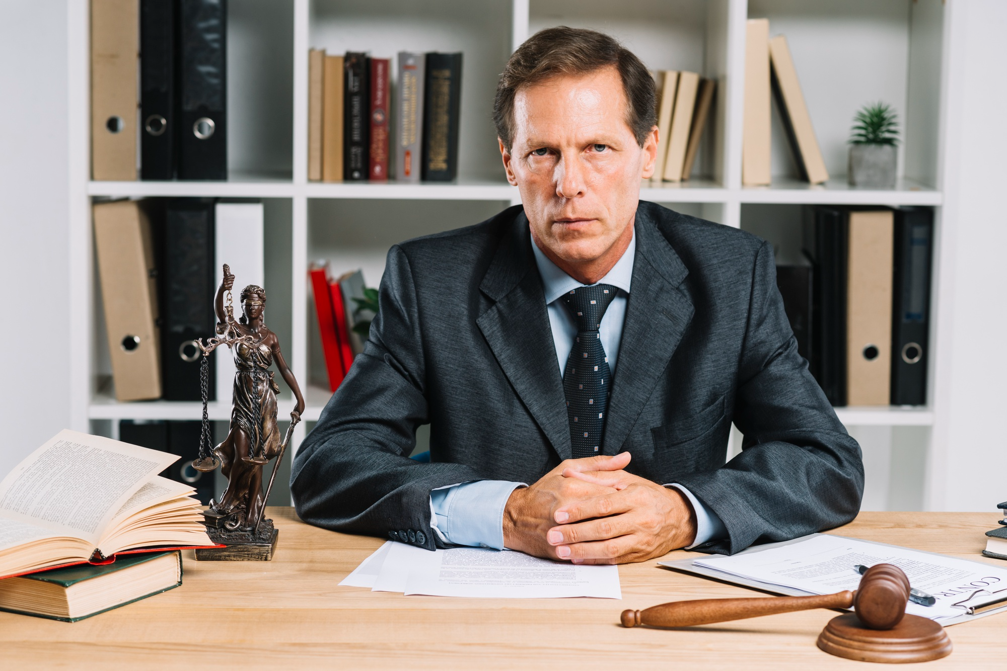 A lawyer sitting at his desk