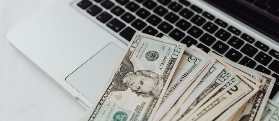 money on a laptop