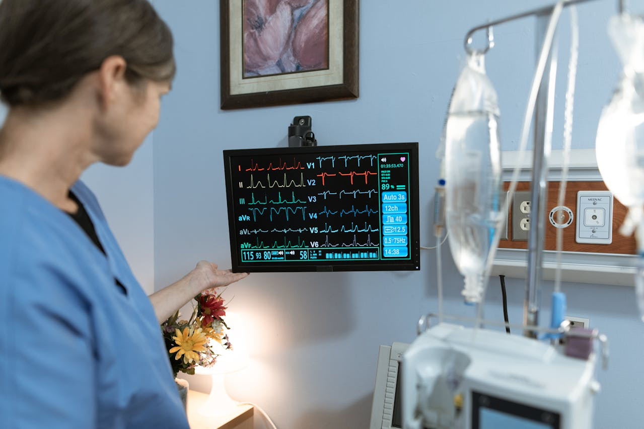 nurse looking at a monitor at a hospital