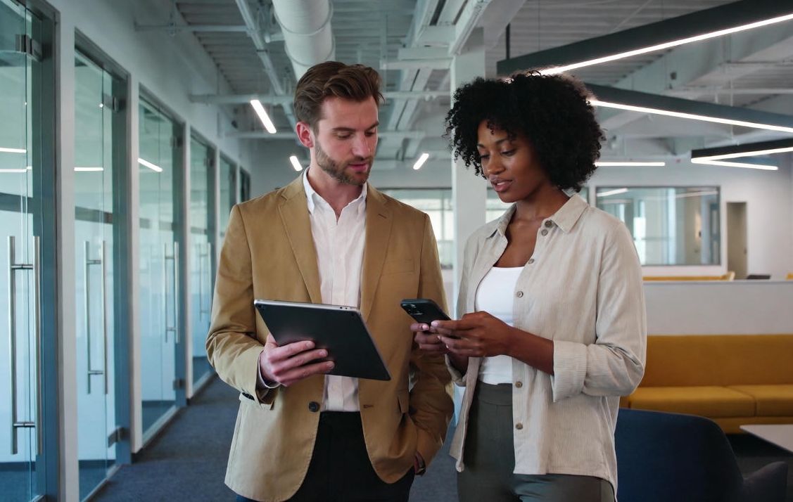 2 people looking at a tablet