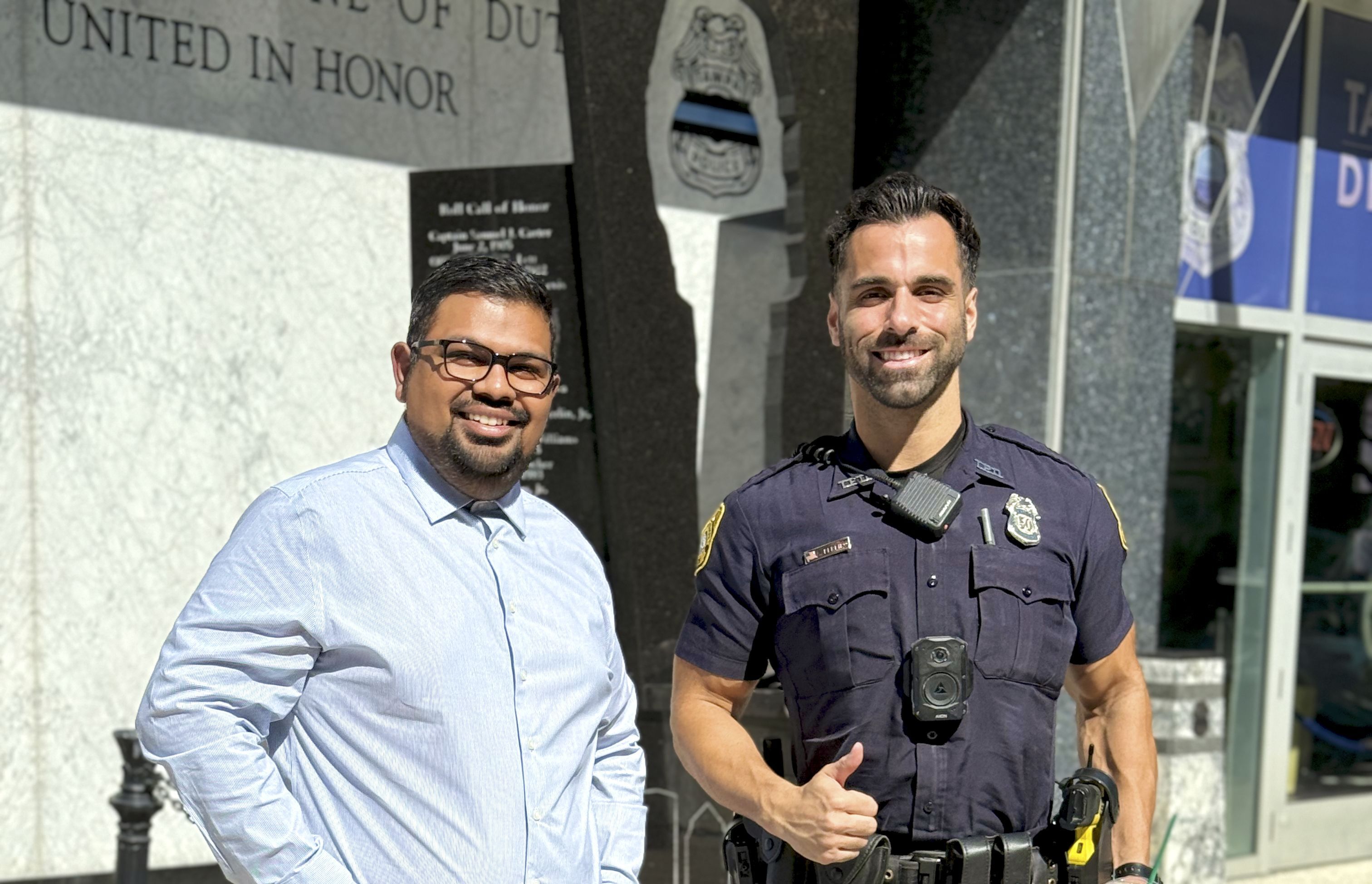 Parth Bamania pictured alongside a Tampa Police officer during a visit in downtown Tampa, Florida, USA