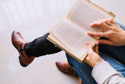 How to Dive into Fantasy Books: Image of a sitting person reading