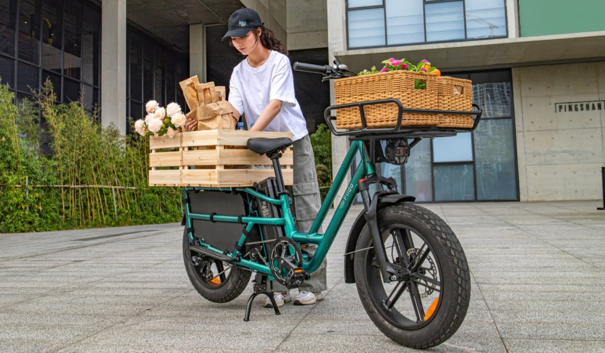 woman holding a bike
